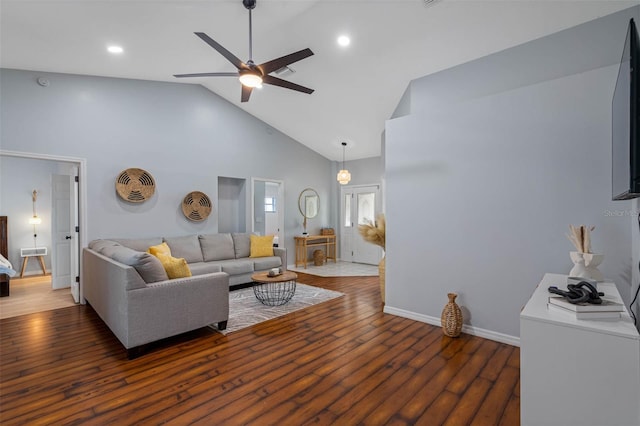 living room featuring ceiling fan, dark wood-type flooring, and high vaulted ceiling