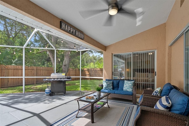 sunroom / solarium featuring ceiling fan and lofted ceiling