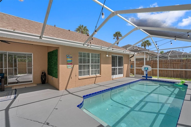 view of pool featuring a lanai and a patio