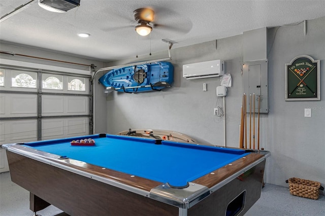 playroom with a wall mounted air conditioner, electric panel, ceiling fan, a textured ceiling, and pool table