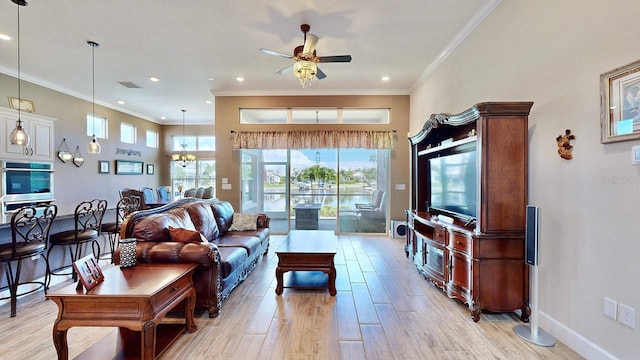 living room featuring crown molding, ceiling fan with notable chandelier, and light wood-type flooring