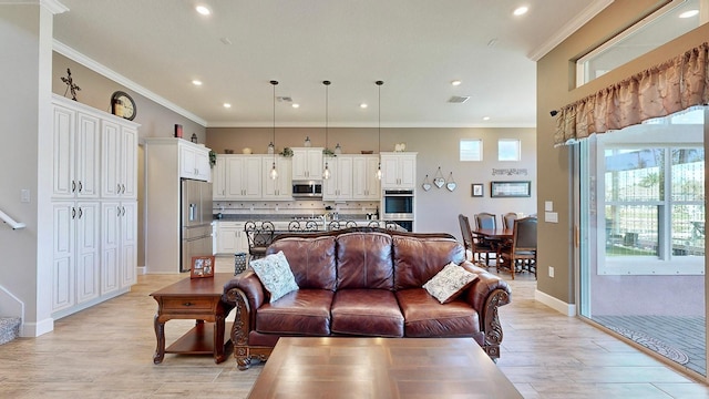 living room with crown molding and light hardwood / wood-style flooring