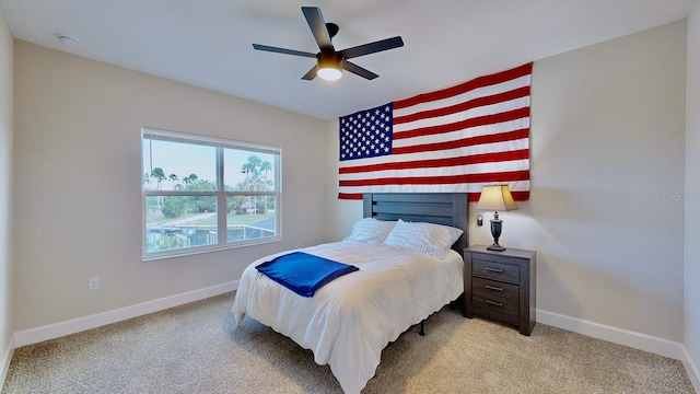 carpeted bedroom with ceiling fan