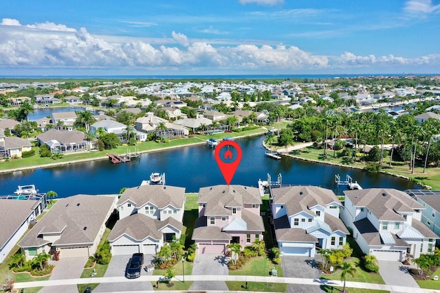birds eye view of property featuring a residential view and a water view