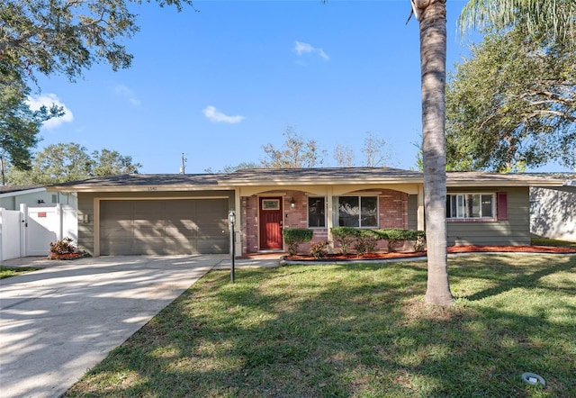 ranch-style home with a garage and a front lawn