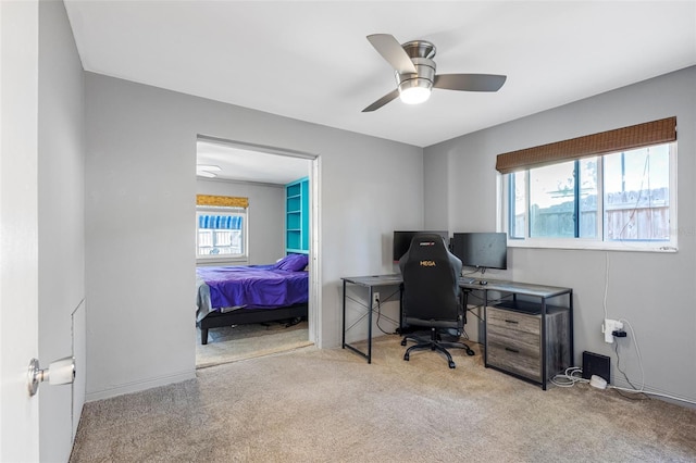 carpeted office with ceiling fan