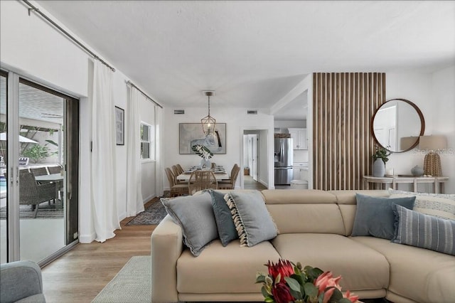 living room featuring light hardwood / wood-style floors and plenty of natural light