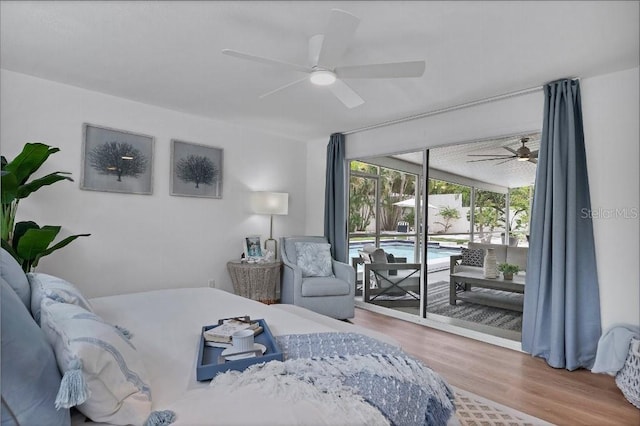 bedroom featuring access to exterior, ceiling fan, and hardwood / wood-style floors