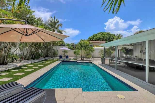 view of swimming pool with a patio