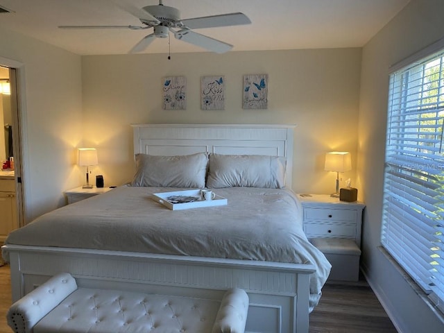 bedroom with ceiling fan and dark hardwood / wood-style floors