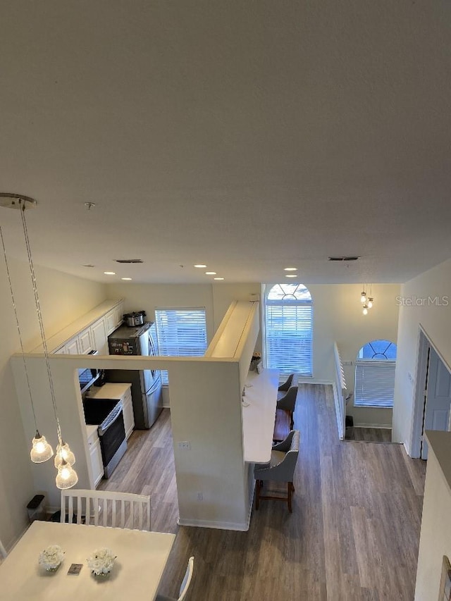 interior space featuring hardwood / wood-style floors and a wealth of natural light