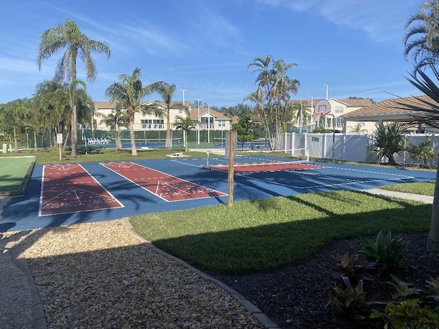 view of basketball court featuring a lawn