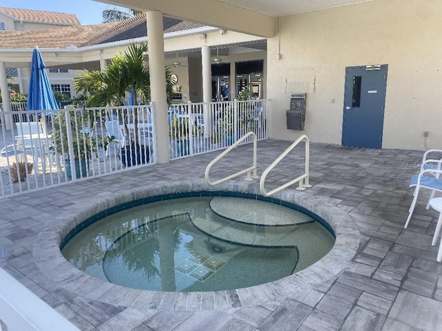 view of pool featuring a hot tub