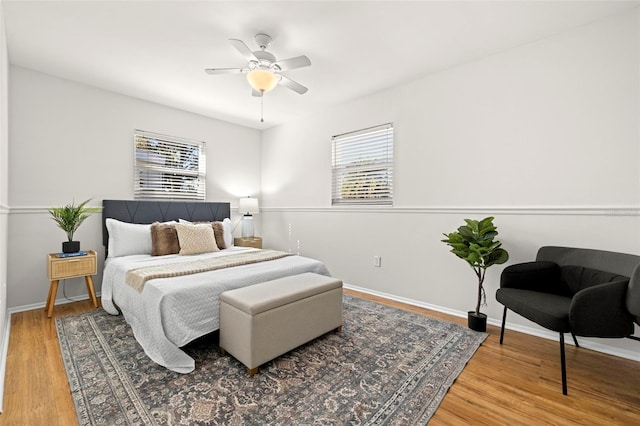 bedroom featuring wood-type flooring and ceiling fan