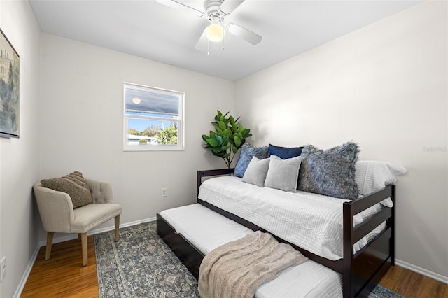 bedroom featuring hardwood / wood-style flooring and ceiling fan