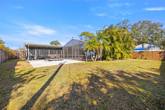 view of yard featuring a patio area and a sunroom