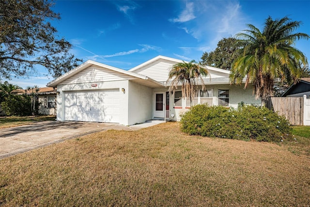 ranch-style home featuring a garage and a front lawn