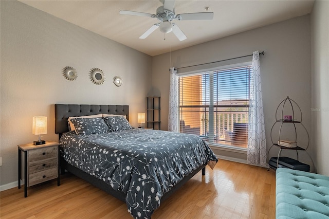 bedroom with hardwood / wood-style flooring and ceiling fan