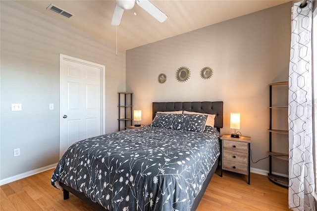 bedroom with ceiling fan and light hardwood / wood-style floors