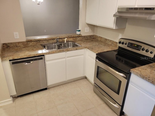 kitchen with ventilation hood, sink, white cabinets, and appliances with stainless steel finishes