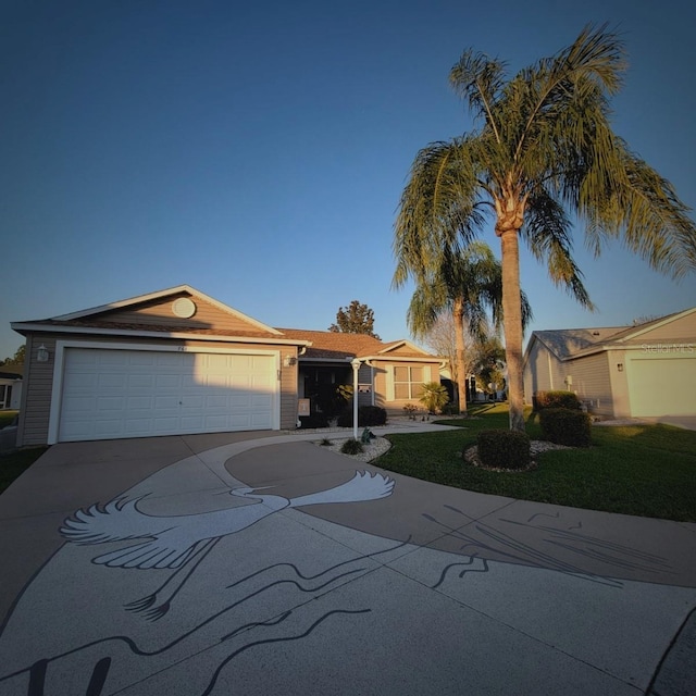 view of front facade with a garage and a front yard