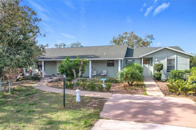 ranch-style home with a front lawn