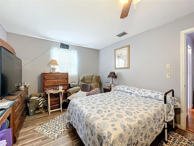 bedroom featuring light wood-type flooring and ceiling fan