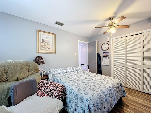 bedroom featuring hardwood / wood-style floors, a closet, and ceiling fan