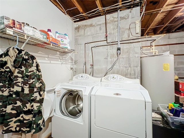 washroom featuring washing machine and dryer and gas water heater