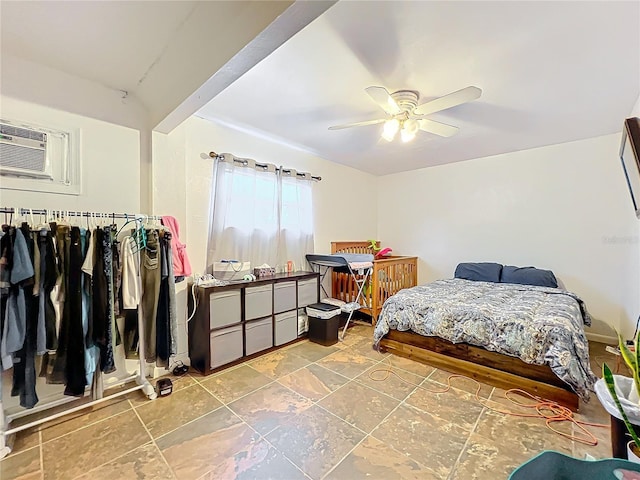 bedroom featuring an AC wall unit, ceiling fan, and beamed ceiling