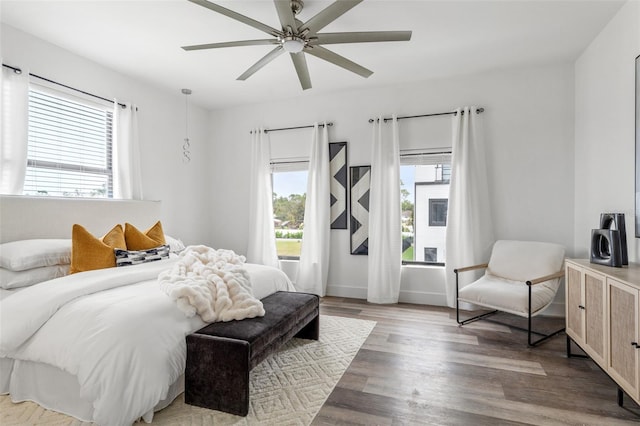 bedroom with ceiling fan and hardwood / wood-style floors