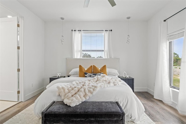 bedroom featuring ceiling fan and light wood-type flooring