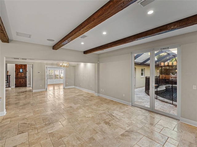 unfurnished living room featuring beamed ceiling, french doors, and a notable chandelier