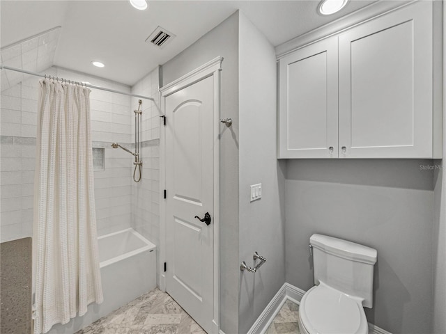 bathroom with shower / bath combination with curtain and toilet