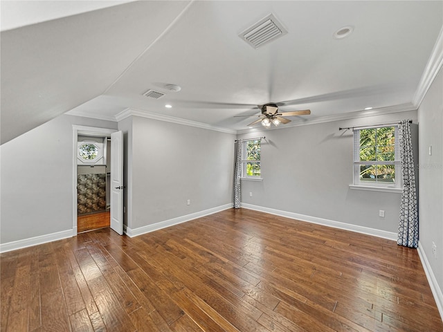 interior space featuring dark hardwood / wood-style floors, vaulted ceiling, and ceiling fan