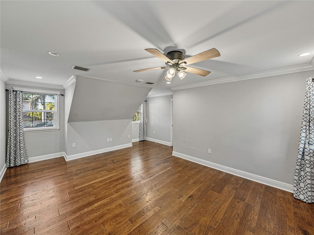 bonus room featuring dark hardwood / wood-style floors, vaulted ceiling, and ceiling fan