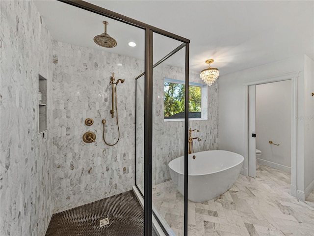 bathroom with plus walk in shower and an inviting chandelier