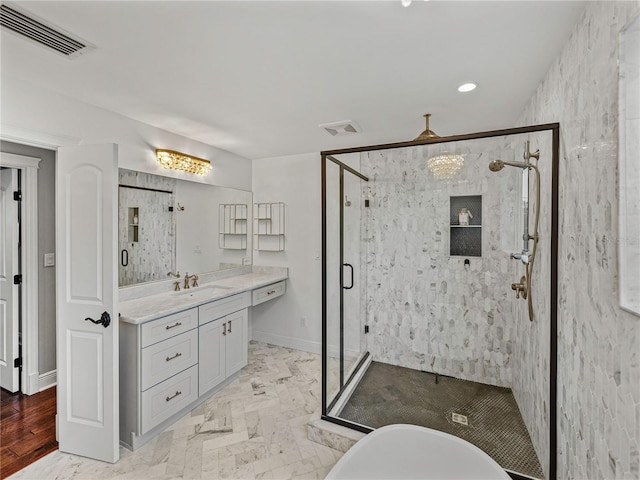 bathroom with vanity and separate shower and tub