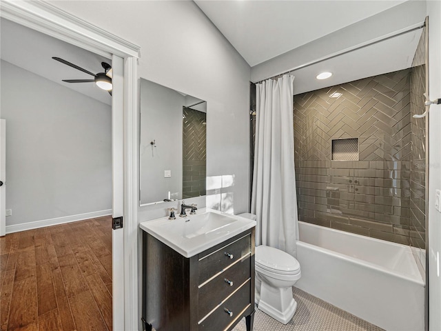 full bathroom with hardwood / wood-style floors, vanity, ceiling fan, toilet, and shower / tub combo with curtain