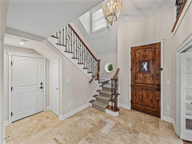 foyer entrance featuring a chandelier