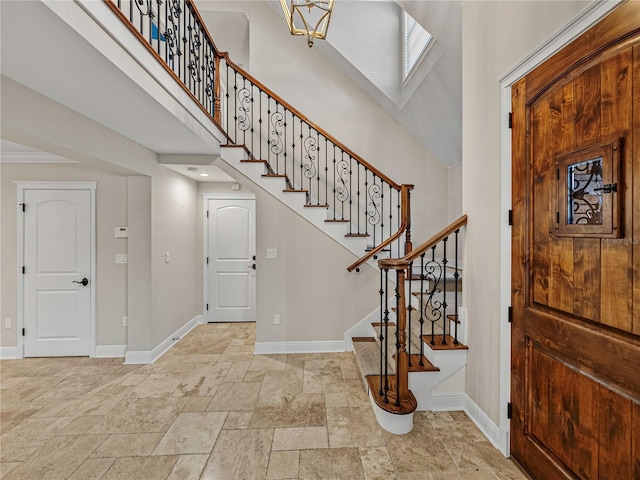 foyer with a towering ceiling