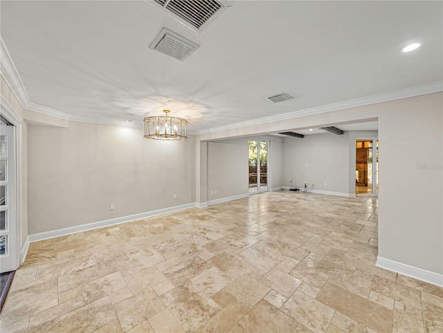 empty room featuring ornamental molding and a chandelier