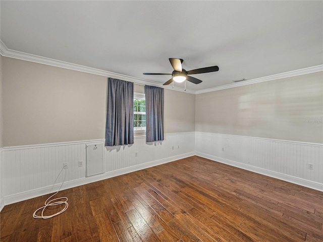 empty room featuring crown molding, ceiling fan, and wood-type flooring