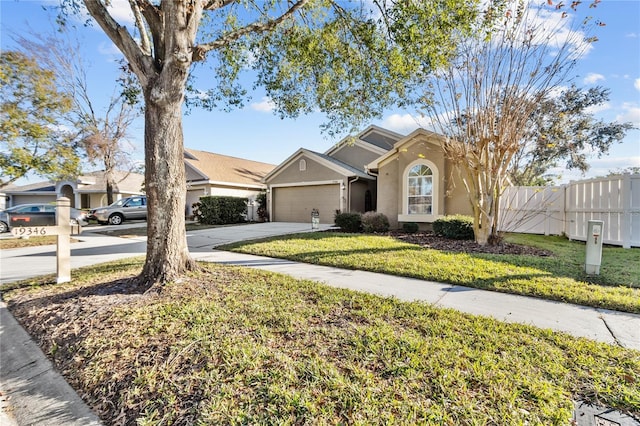 view of front facade with a front lawn and a garage