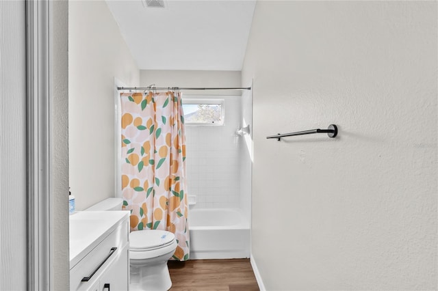 full bathroom featuring shower / tub combo with curtain, vanity, hardwood / wood-style floors, and toilet