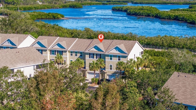 birds eye view of property featuring a water view