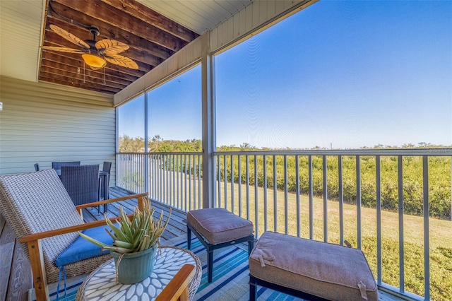 sunroom / solarium with ceiling fan