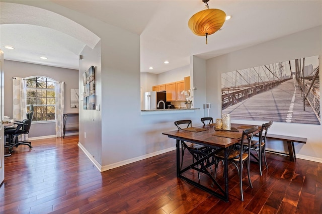 dining space with dark wood-type flooring