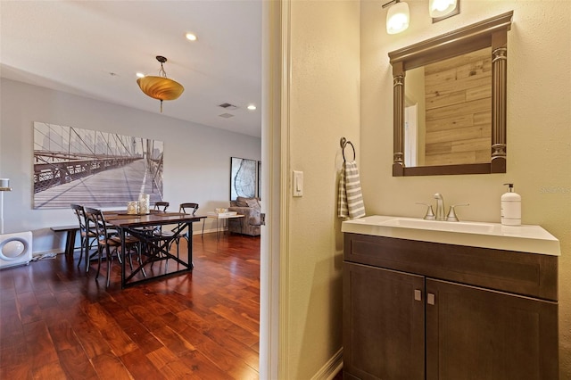 bathroom featuring wood-type flooring and vanity