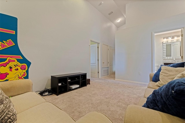 living room featuring high vaulted ceiling and light colored carpet